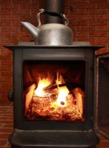 Tea Kettle on Stove and Fire
