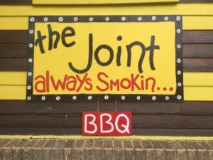 A sign that says the joint always smokin bbq