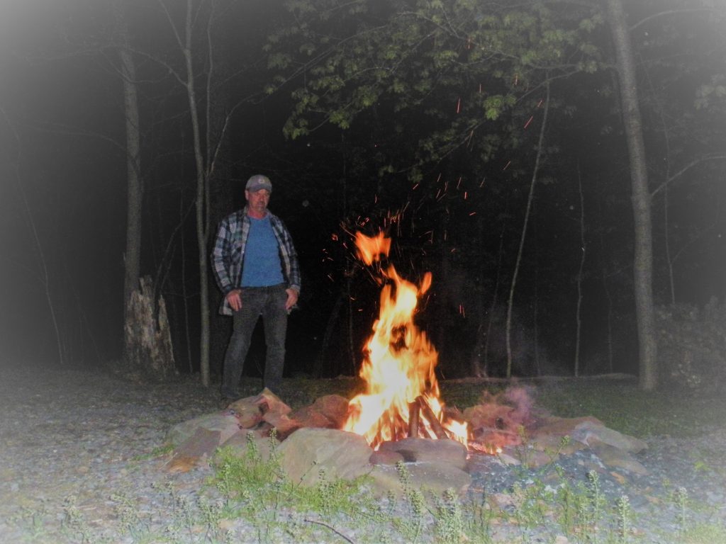Brian Standing by Firepit