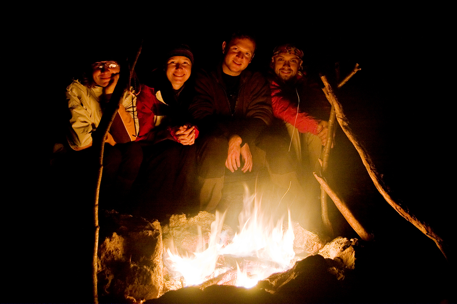 Young Adults at Campfire