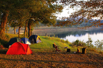 A group of tents set up near the water.